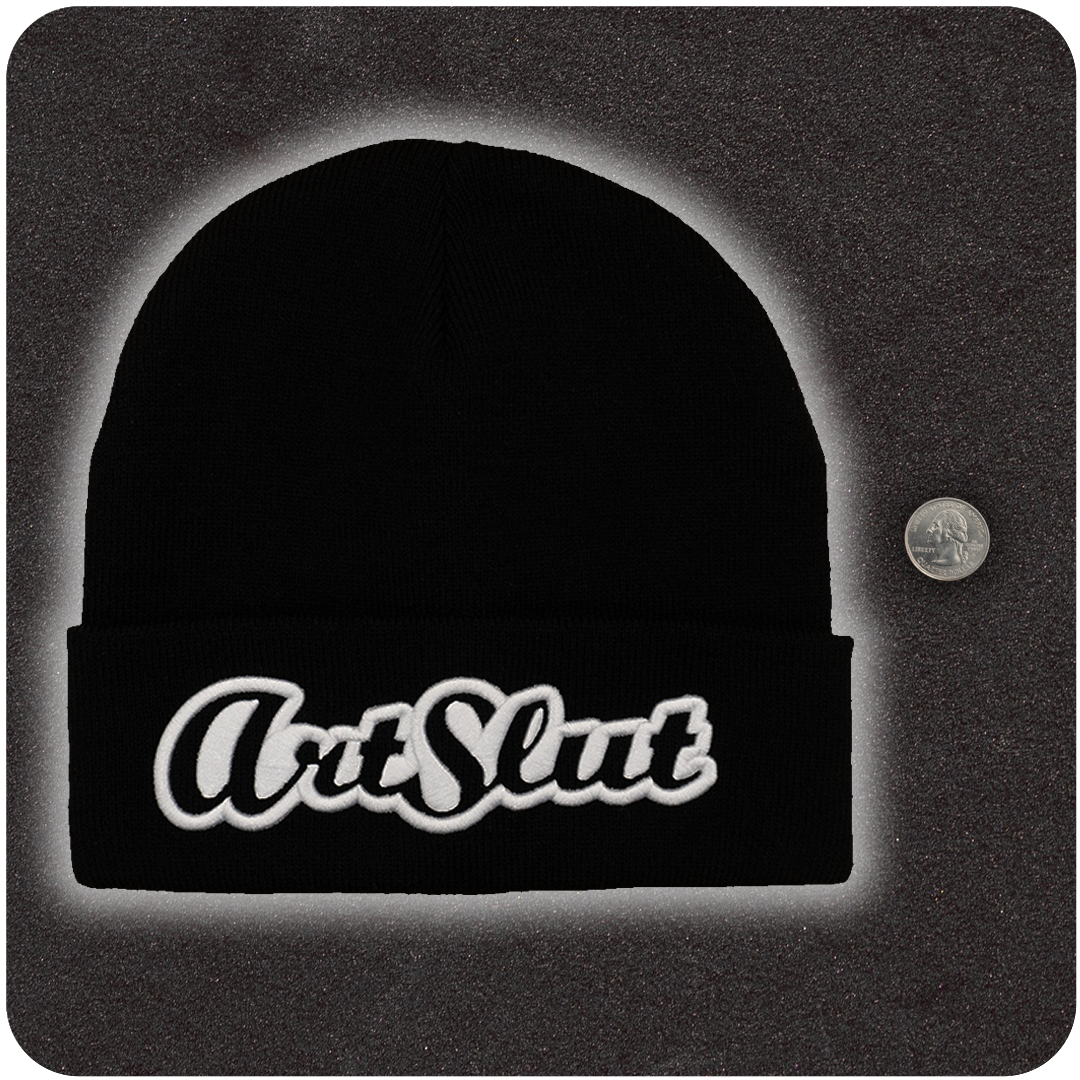Casual Covert Art Slut Beanie next to a quarter to show relative scale.