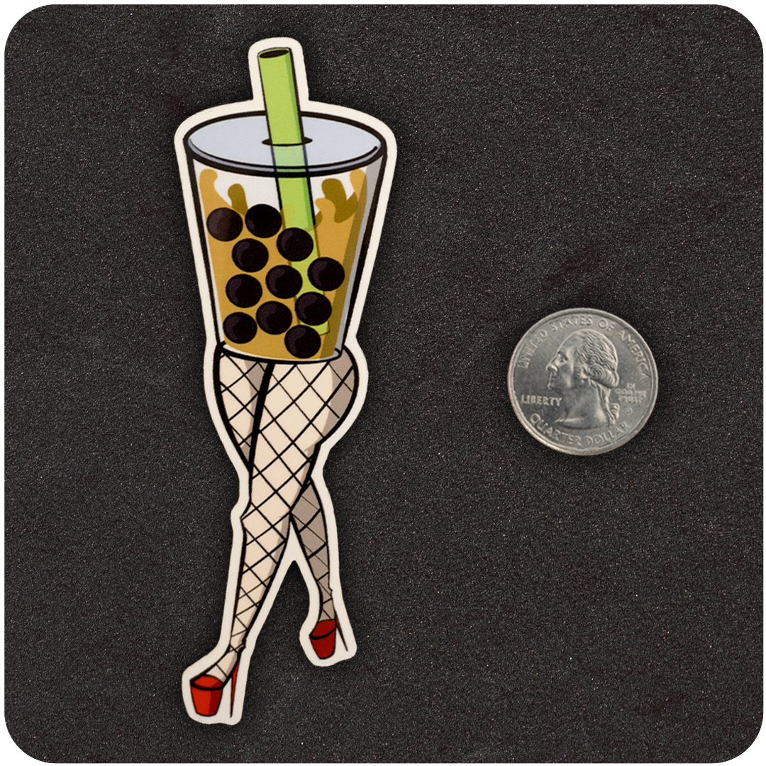 A vinyl sticker featuring a stylized cup of boba tea with a green straw and large black tapioca pearls. The cup is personified with shapely legs in fishnet stockings and red high heels, posed flirtatiously. A U.S. quarter is placed next to the sticker for size comparison, all on a dark textured background.