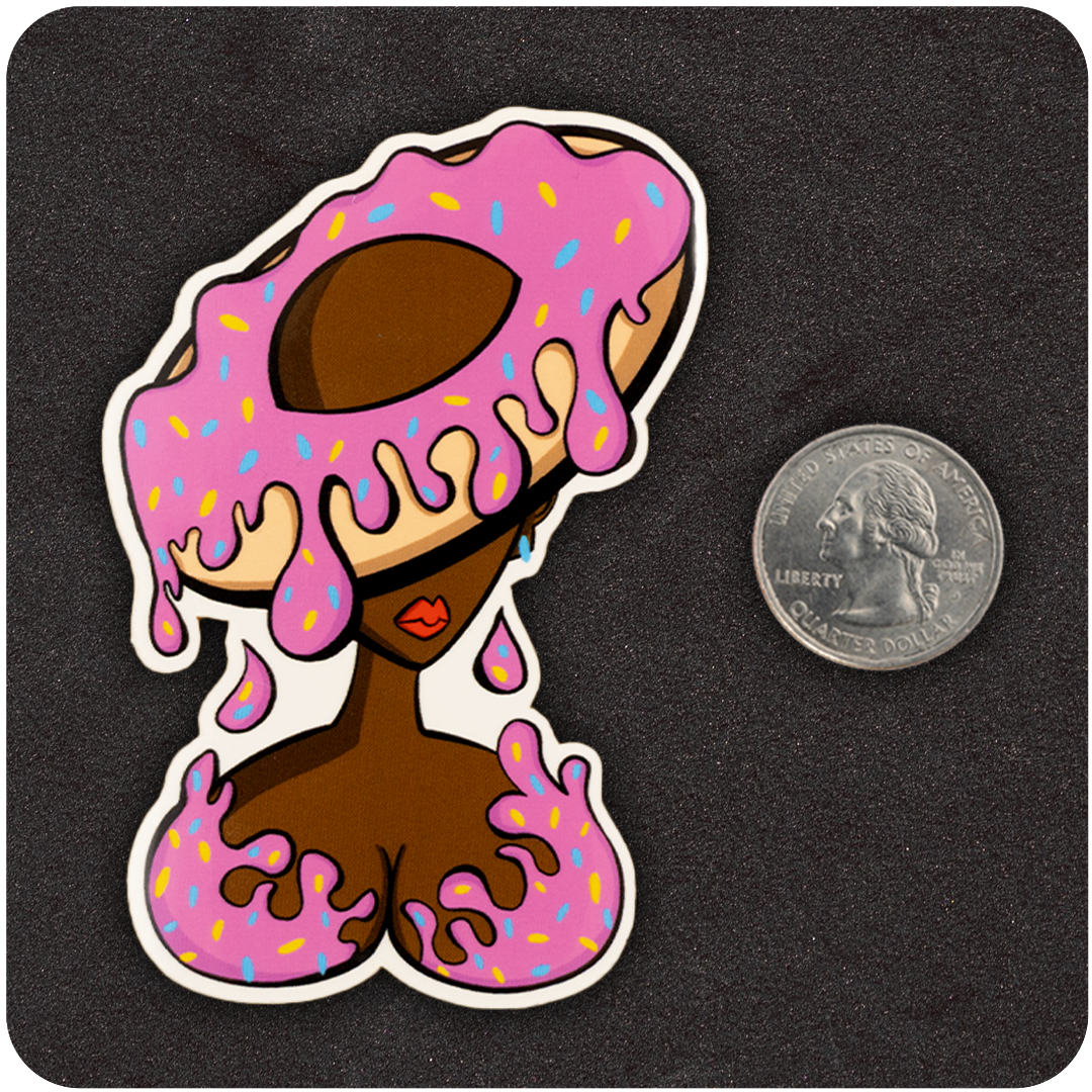 The Casual Covert DoughNUT Lady vinyl sticker next to a quarter for scale.