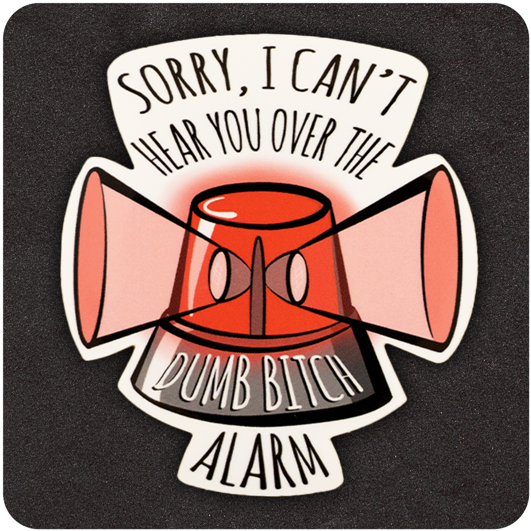 A funny vinyl sticker showing a red emergency alarm siren with two large pink megaphones on either side. Black curved text above the image reads, “SORRY, I CAN’T HEAR YOU OVER THE,” while the alarm itself features white text that says, “DUMB BITCH ALARM.” The sticker is placed on a dark, textured background.