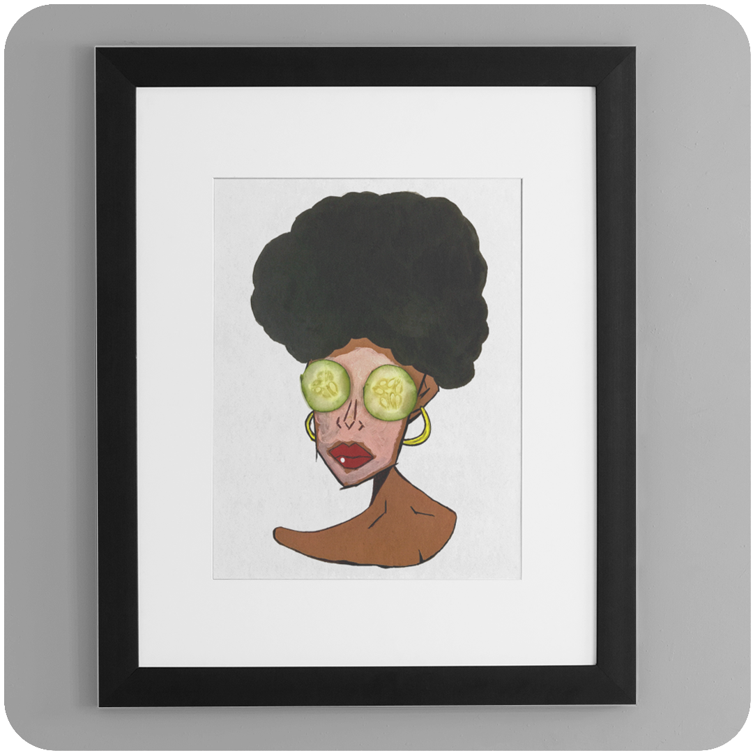 A framed art print hanging on a smooth, light gray wall. The artwork features a stylized portrait of a brown-skinned woman with a large, textured black afro. She wears oversized gold hoop earrings and has slices of cucumber over her eyes, suggesting a self-care theme. The frame is black with a white mat, giving the print a clean, modern gallery look.