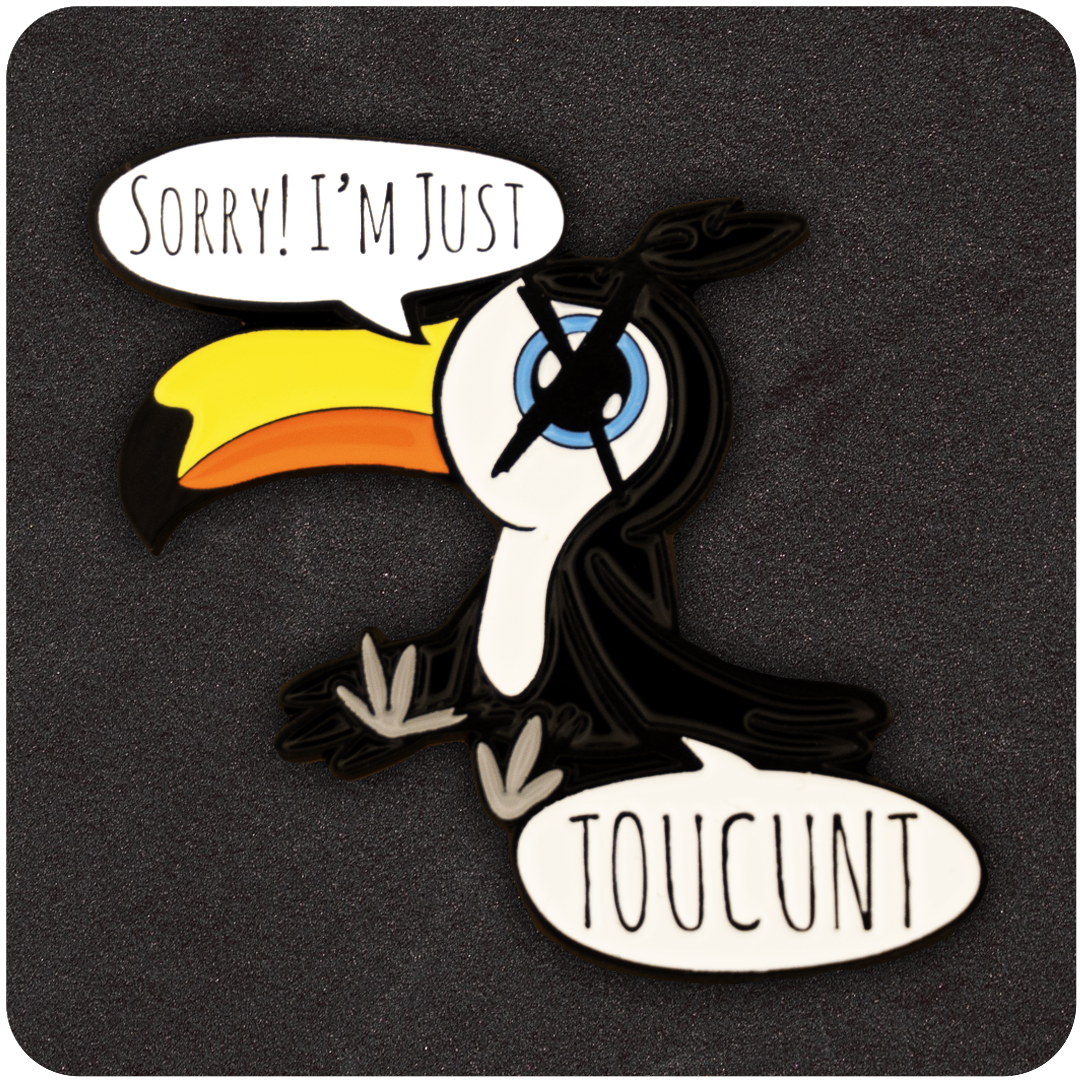 Funny enamel pin featuring a cartoon toucan with a bright yellow beak, saying “Sorry! I’m Just TOUCUNT” in speech bubbles, against a black textured background.