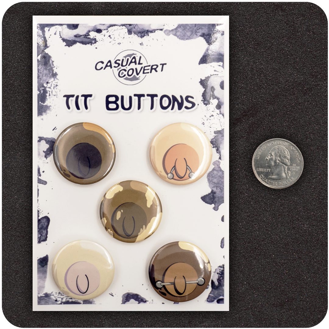 Set of five Casual Covert “Tit Buttons” enamel pins featuring diverse cartoon nipples with unique styles and piercings, displayed on branded backing card next to a U.S. quarter for size reference — playful, body-positive flair pins.