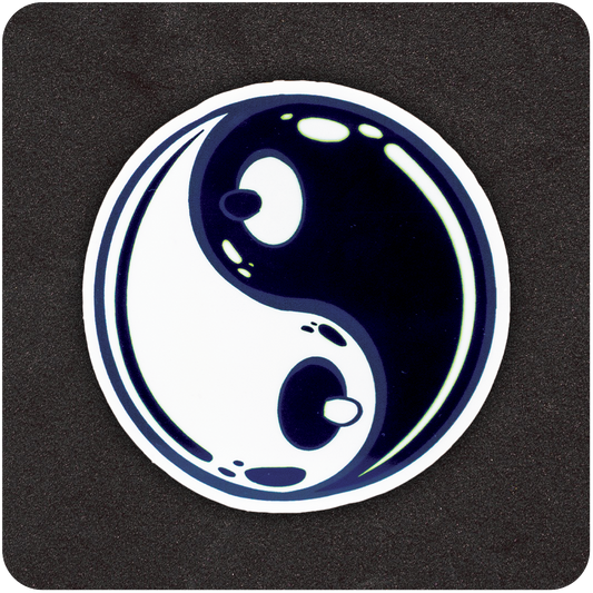 A circular sticker featuring a stylized yin-yang symbol on a black background. The traditional black and white teardrop shapes are subtly shaped to resemble cartoon breasts, with small nipples at the center of each dot. The design has a glossy, bubble-like finish with highlights to suggest shine and dimension.
