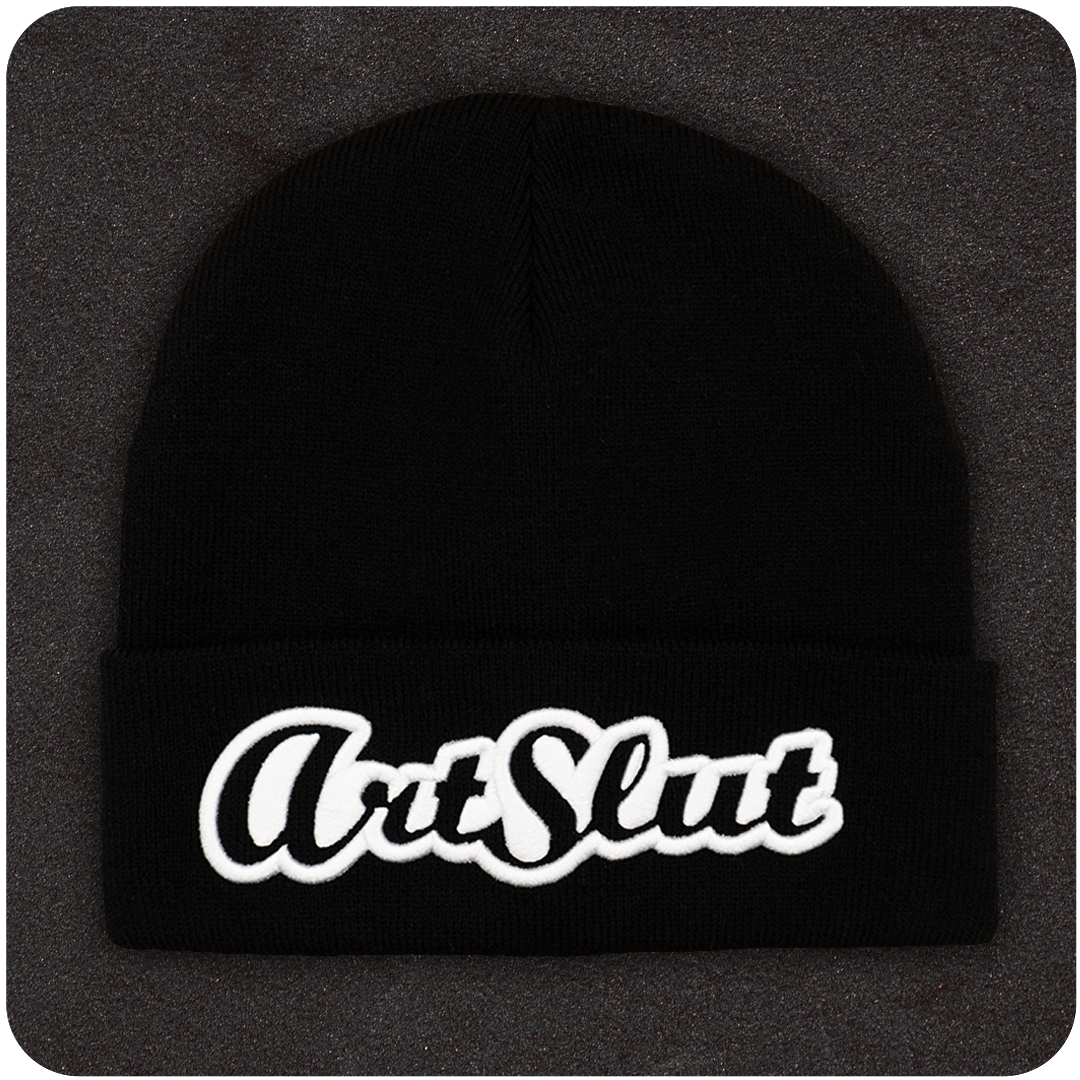 Casual Covert Art Slut Beanie. A black beanie with white 3D embroidery of the term "art slut" on it.