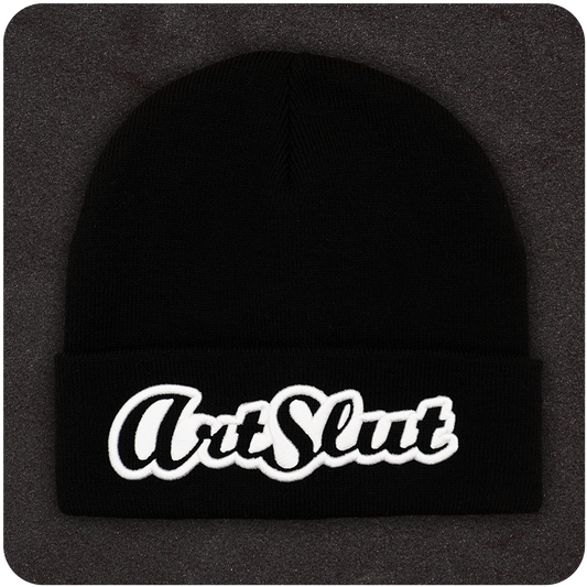 Casual Covert Art Slut Beanie. A black beanie with white 3D embroidery of the term "art slut" on it.