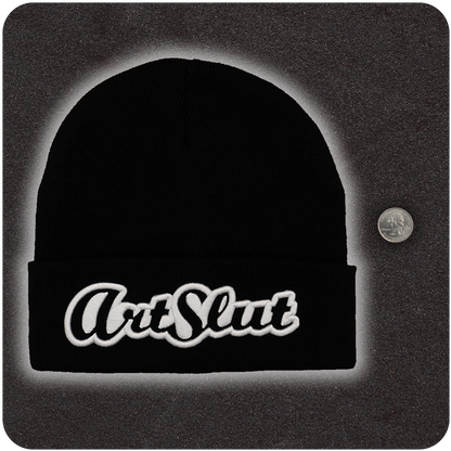 Casual Covert Art Slut Beanie next to a quarter to show relative scale. 