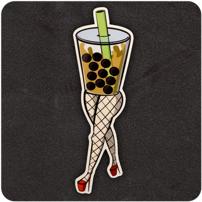 A vinyl sticker depicting a playful illustration of a cup of boba tea with a large green straw and brown tapioca pearls. The cup is anthropomorphized with curvy legs wearing fishnet stockings and red high heels, striking a flirty pose. The background is a dark, textured black surface.