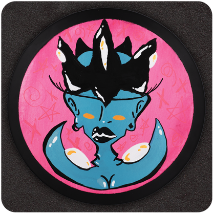 Original circular painting titled “Crown My Clit,” featuring a blue-skinned, stylized femme figure with orange eyes, full black lips, and a bold black crown with white and yellow highlights, set against a vivid pink background with abstract symbols.
