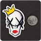 The Casual Covert Crown Bitch vinyl sticker next to a quarter for scale. 