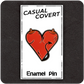 The Casual Covert Demon Tits Enamel Pin on a backing card showing how the customer will receive said enamel pin. 