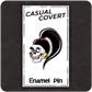 The Casual Covert Drag Me To Hell Enamel Pin on a backing card to show customers how the pin is shipped.