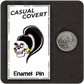 The Casual Covert Drag Me To Hell Enamel Pin next to a quarter to show scale. 