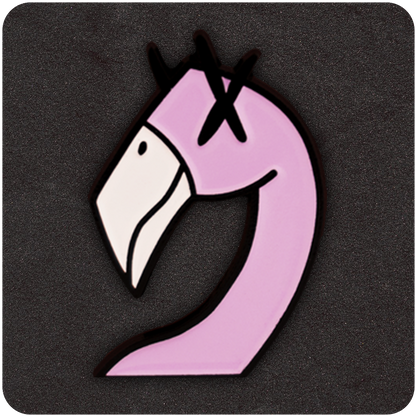Close-up of a pink flamingo-shaped enamel pin with cartoon-style design and X-marked eyes, outlined in black, displayed against a dark textured background.