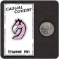 The Casual Covert Flamingo Enamel Pin next to a quarter to show scale.