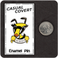 The  Casual Covert I Bee That Bitch Enamel Pin next to a quarter to show it's scale. 