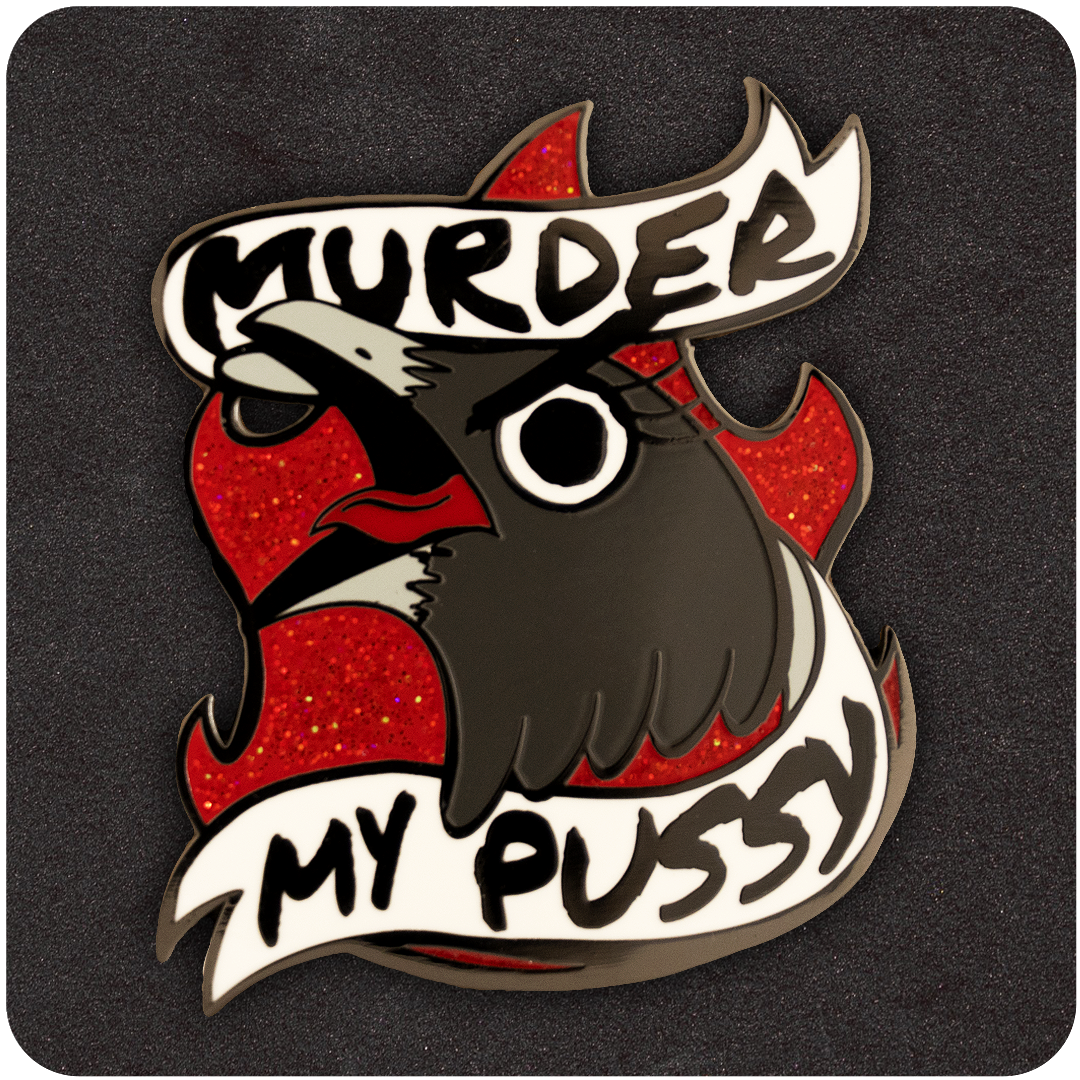 The Casual Covert Murder My Pussy Enamel Pin. Shows a crow screaming with glitter fire behind them with the words "murder my pussy" around them.