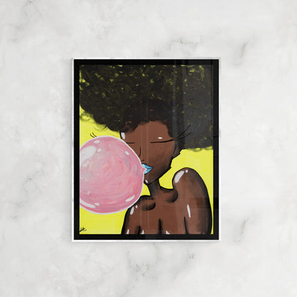 Framed original painting titled “Blow My Pussy” depicting a stylized Black woman with voluminous natural hair, blue lips, and a large pink bubblegum bubble against a vibrant yellow background, displayed on a marble wall.