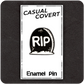 The Casual Covert RIP Enamel Pin with its backing card showing how the pin is packaged. 