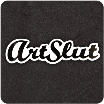 A glossy black die-cut vinyl sticker featuring the bold, stylized script text “ArtSlut.” The typeface is a flowing cursive with thick lines and a modern flair, outlined in white for contrast. The sticker is placed on a textured black background, emphasizing its sleek design and edgy, artistic statement.