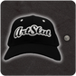 Casual Covert Art Slut Snapback Hat shown next to a quarter for relative scale. 