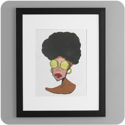 A framed art print hanging on a smooth, light gray wall. The artwork features a stylized portrait of a brown-skinned woman with a large, textured black afro. She wears oversized gold hoop earrings and has slices of cucumber over her eyes, suggesting a self-care theme. The frame is black with a white mat, giving the print a clean, modern gallery look.