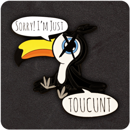 Funny enamel pin featuring a cartoon toucan with a bright yellow beak, saying “Sorry! I’m Just TOUCUNT” in speech bubbles, against a black textured background.