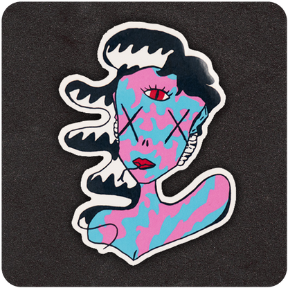 A vibrant, die-cut vinyl sticker featuring a surreal character with flowing black-and-white hair, a blue and pink camouflage-patterned face and body, and bold red lips. The figure has X's over its eyes and a third red eye centered on the forehead, giving it a psychedelic, dreamlike vibe. The sticker is placed on a dark textured background that enhances the bold contrast and whimsical design.