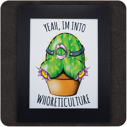 Humorous art print featuring a cartoon cactus shaped like a curvy bottom wearing a pink ball gag and leather straps, blooming from a terracotta pot. The phrase “Yeah, I’m into WHORETICULTURE” is printed above and below the image. Displayed in a black photo mat on a dark background.